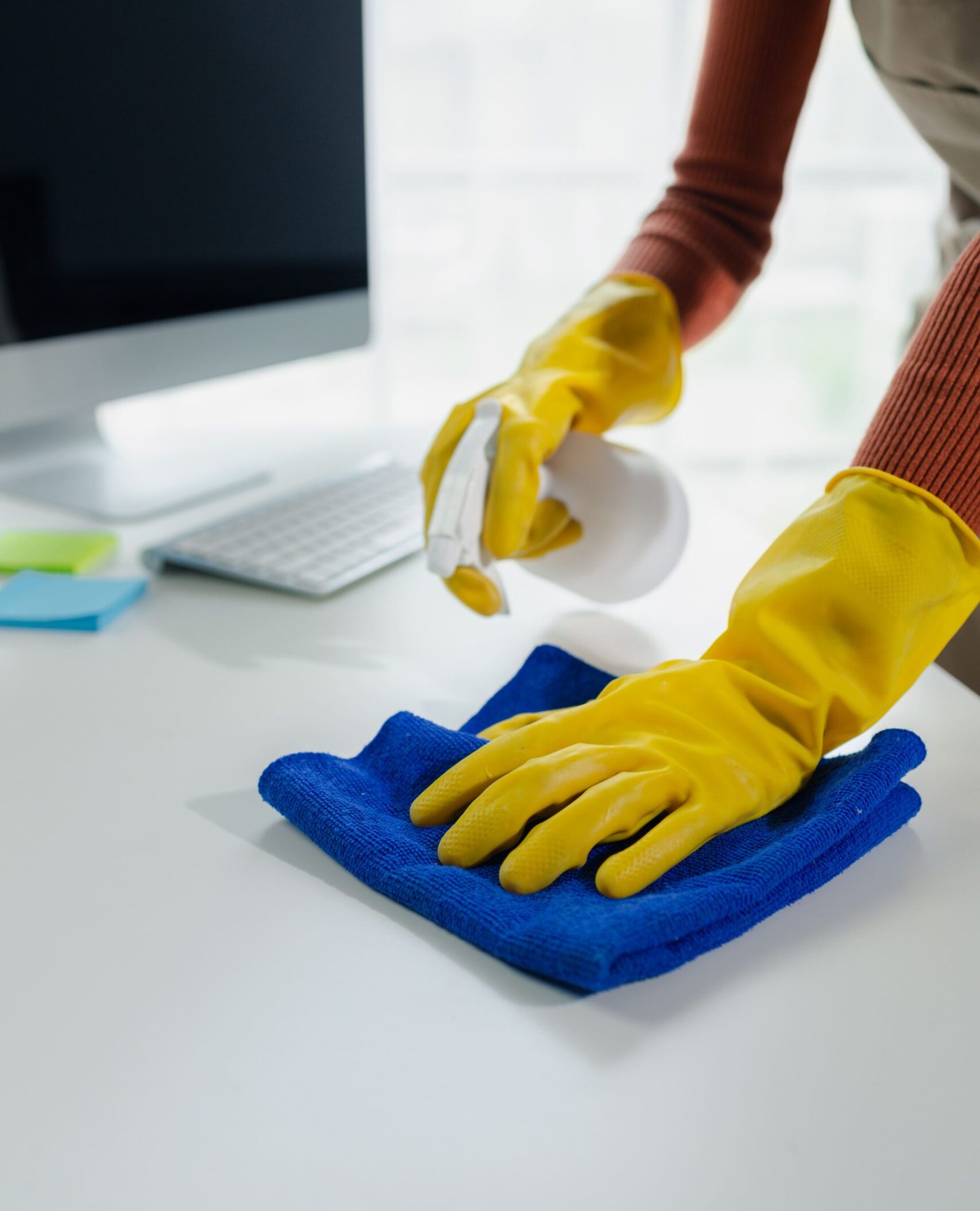 cleaning-desk-surface-in-office-with-sanitizer-spr-2026-01-07-00-58-51-utc (1) (1)